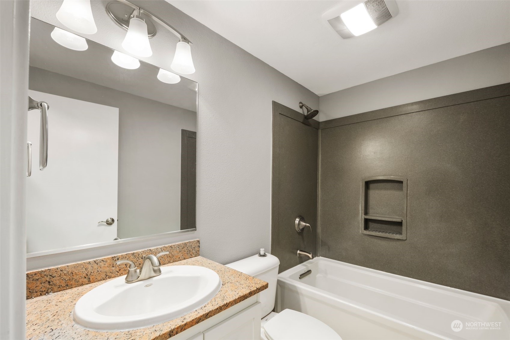 15832 Southeast 144th Street Renton, WA 98059 - Photo 23 of 40 a bathroom with a tub sink and mirror