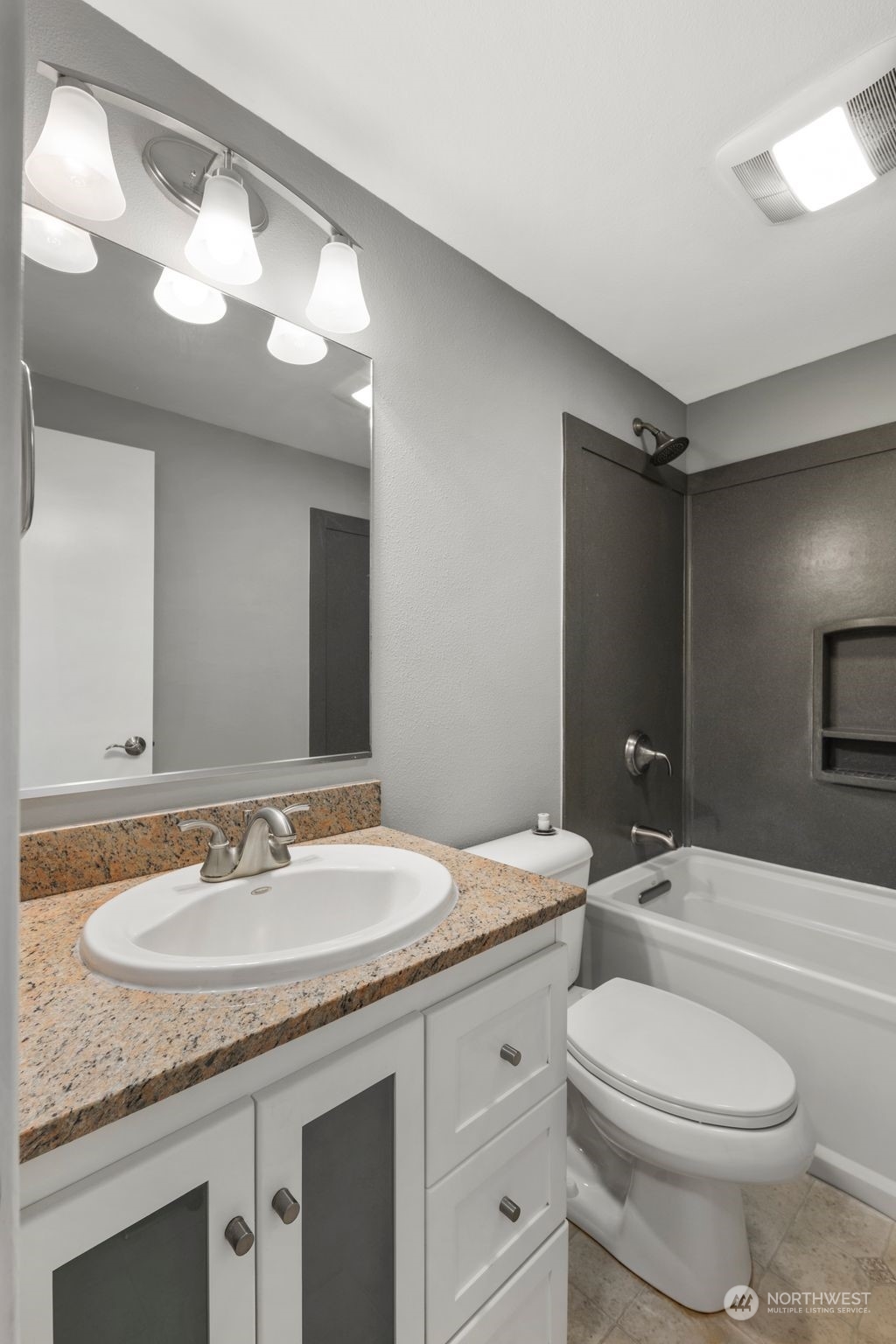 15832 Southeast 144th Street Renton, WA 98059 - Photo 24 of 40 a bathroom with a granite countertop sink toilet and shower
