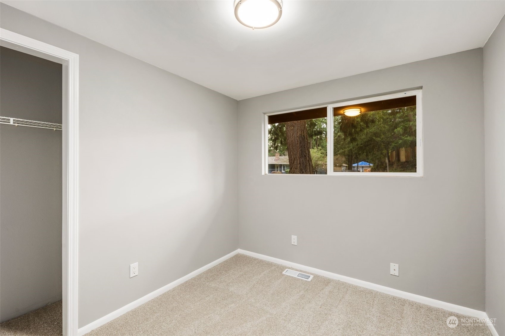 15832 Southeast 144th Street Renton, WA 98059 - Photo 29 of 40 a view of an empty room with a window