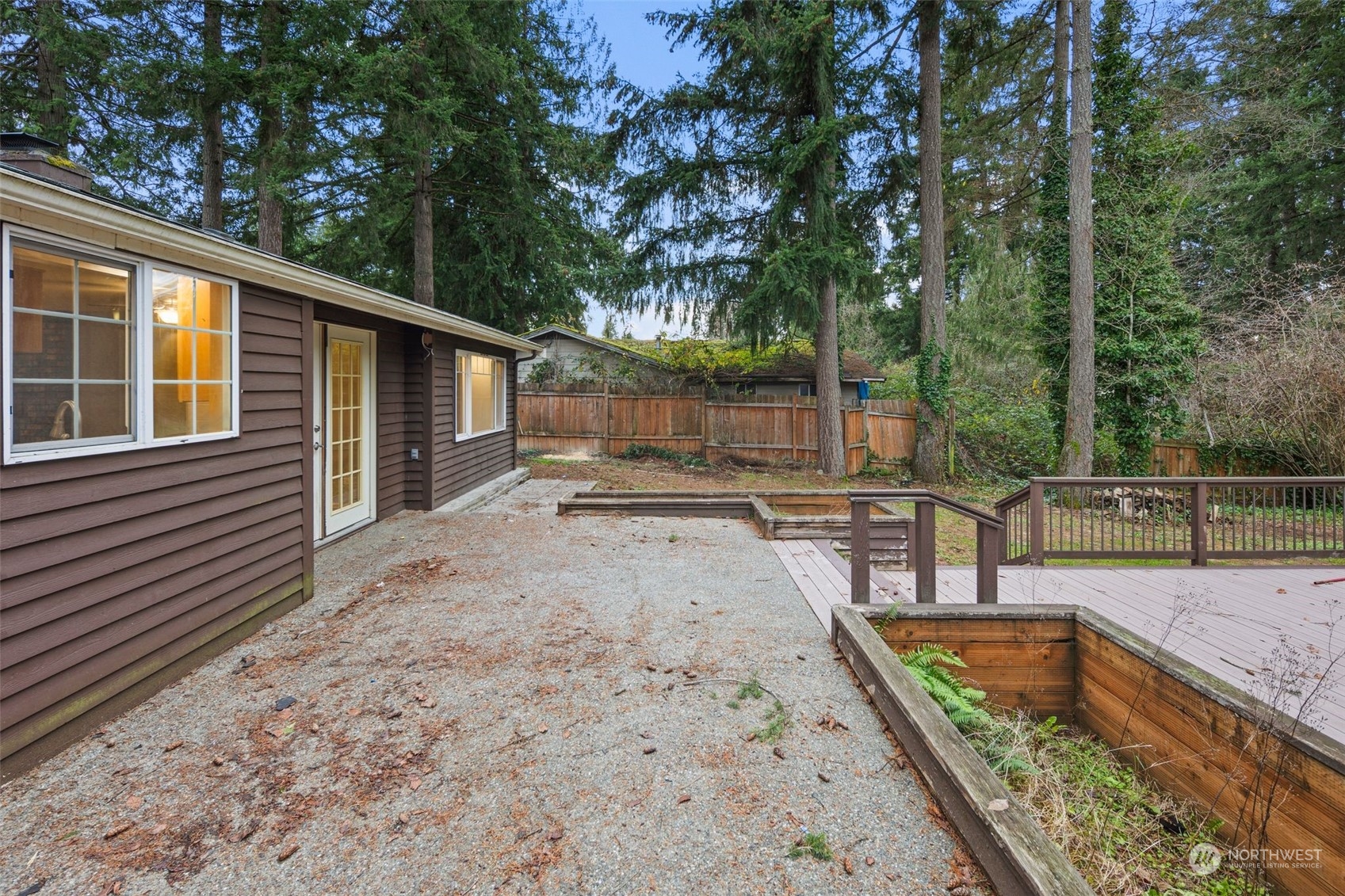 15832 Southeast 144th Street Renton, WA 98059 - Photo 3 of 40 a view of a backyard with a large tree