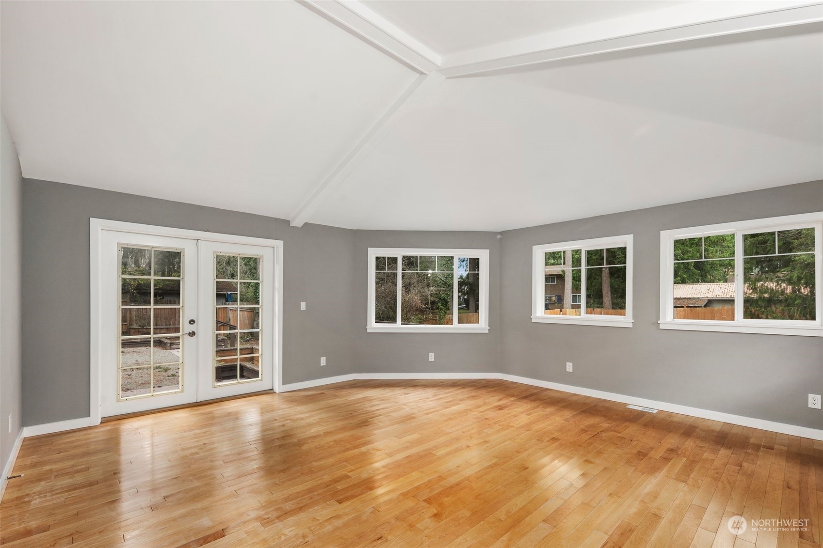 15832 Southeast 144th Street Renton, WA 98059 - Photo 36 of 40 an empty room with wooden floor and windows