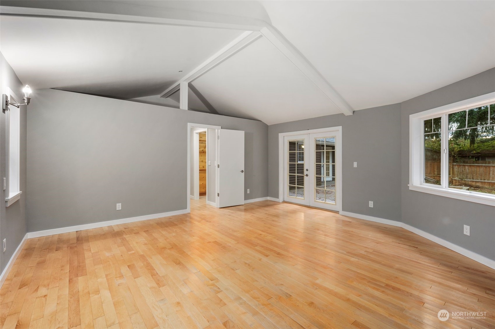 15832 Southeast 144th Street Renton, WA 98059 - Photo 39 of 40 a view of an empty room with a window and wooden floor