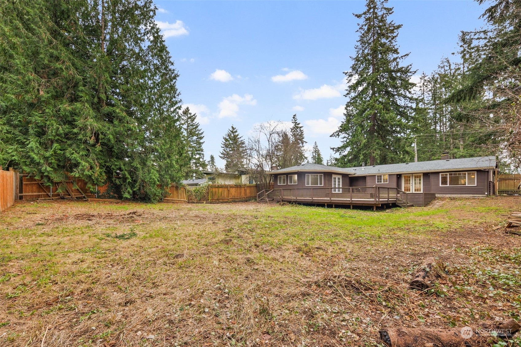 15832 Southeast 144th Street Renton, WA 98059 - Photo 9 of 40 a view of a house with backyard and trees