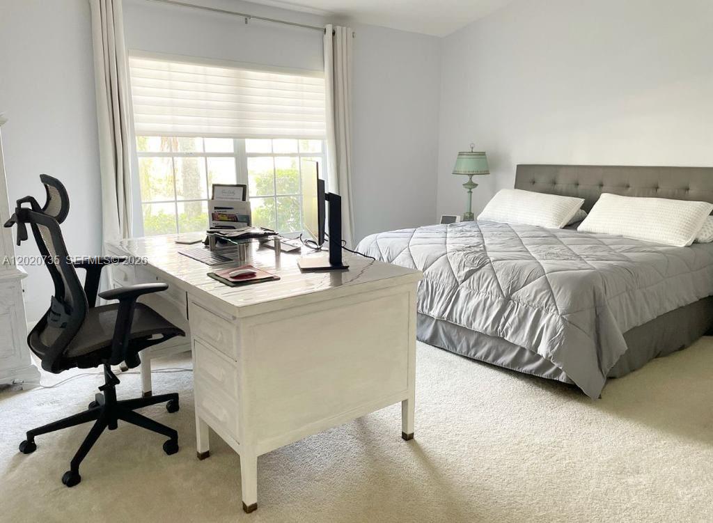 17244 Balboa Point Way Boca Raton, FL 33487 - Photo 35 of 66 a bedroom with a bed and a desk