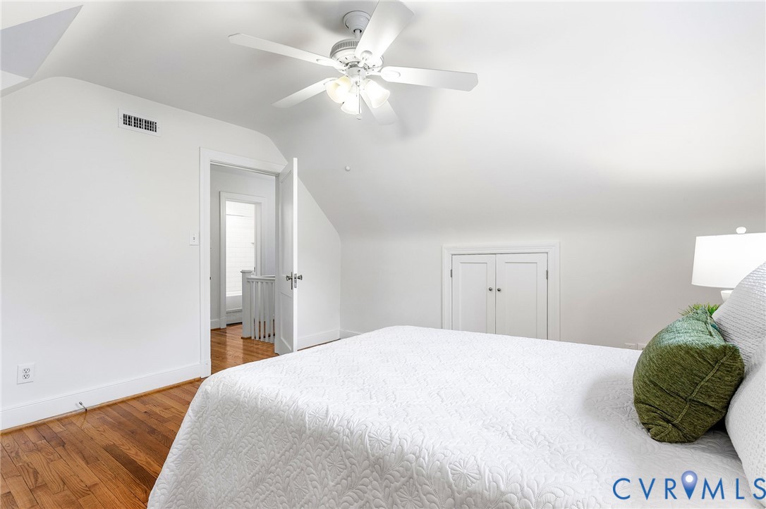 1100 Skipwith Road Henrico, VA 23229 - Photo 22 of 34 a bedroom with a bed and a chandelier