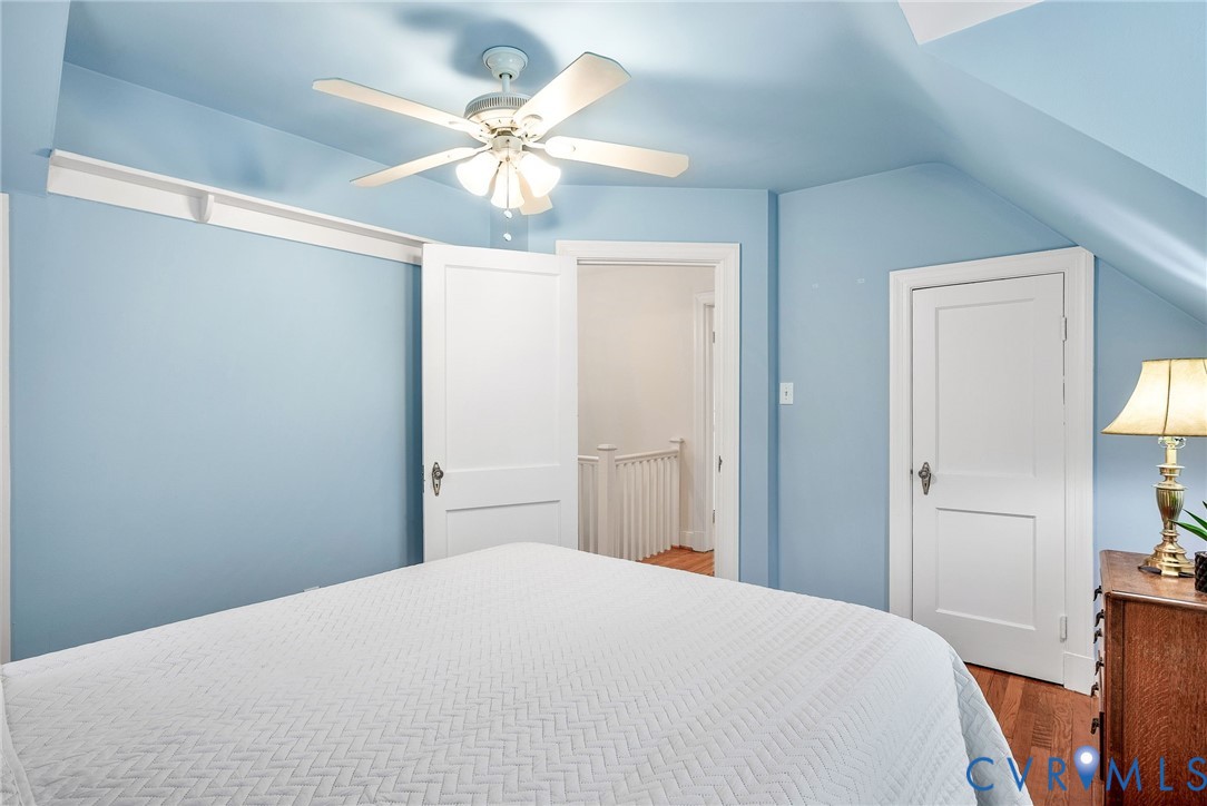 1100 Skipwith Road Henrico, VA 23229 - Photo 26 of 34 a bedroom with a bed and a chandelier