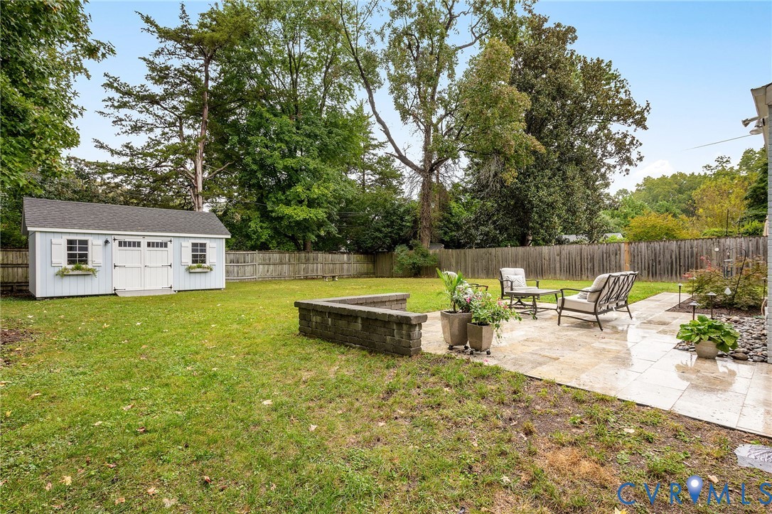 1100 Skipwith Road Henrico, VA 23229 - Photo 28 of 34 a view of a swimming pool with a bench and some trees