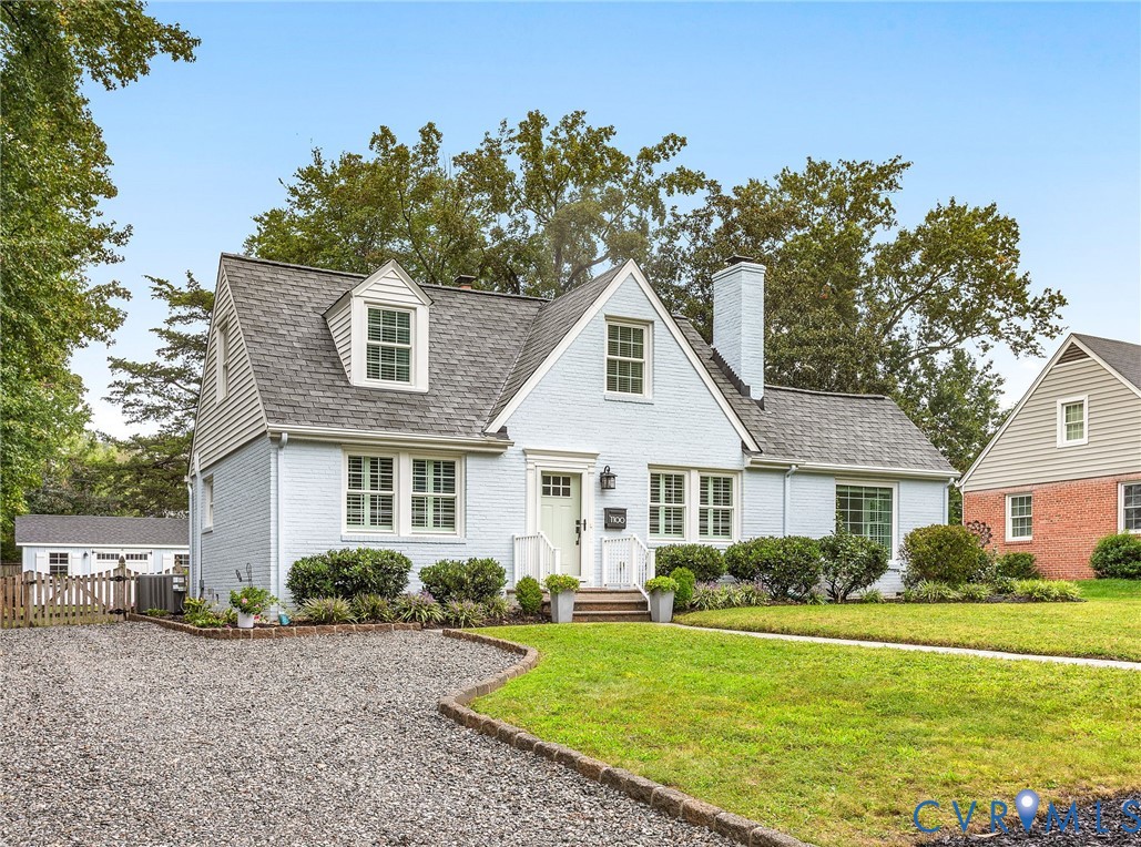 1100 Skipwith Road Henrico, VA 23229 - Photo 3 of 34 a front view of a house with a garden