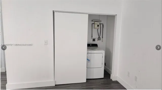 a view of storage and utility room with closet