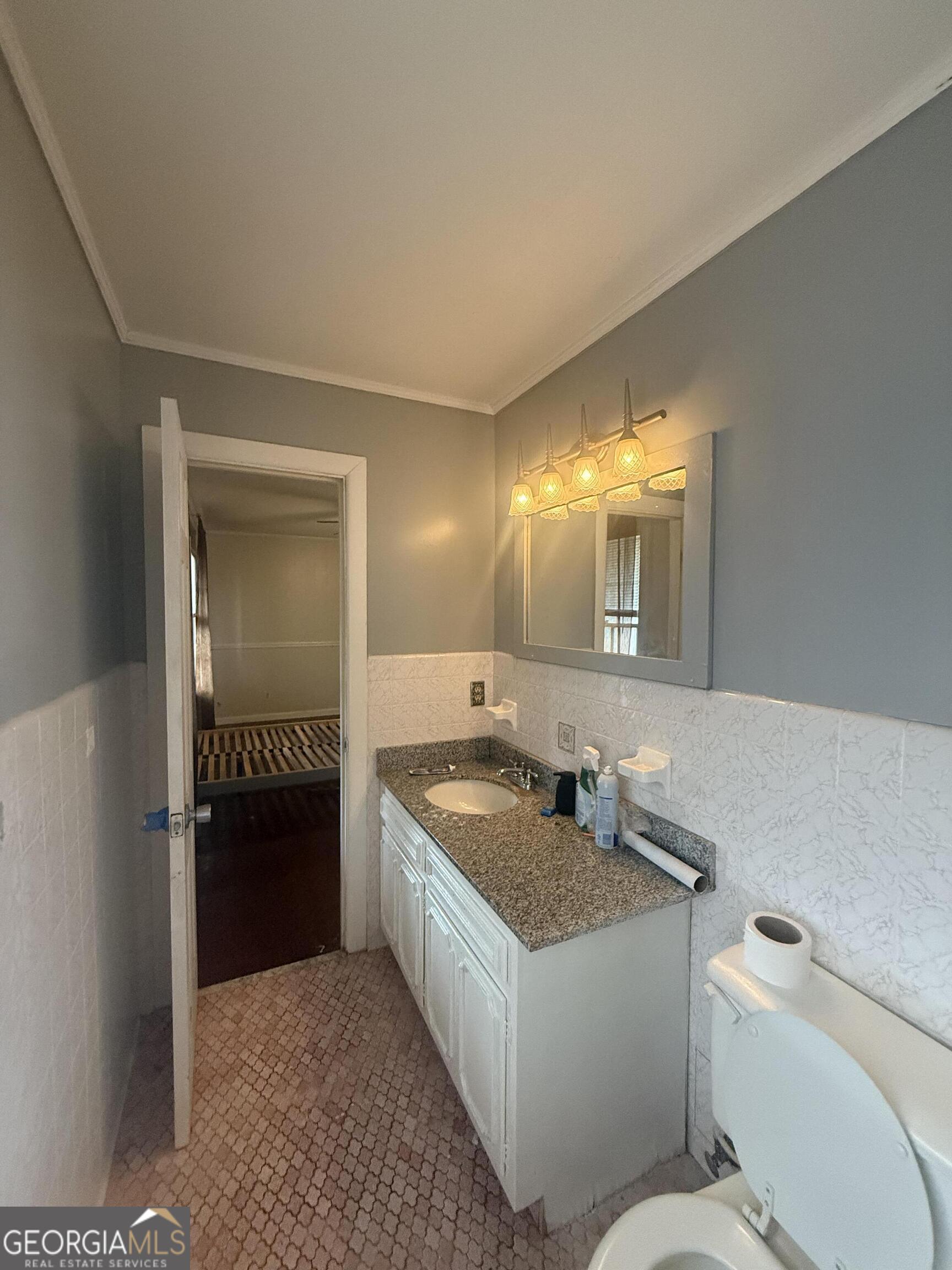 3861 Newnan Road Griffin, GA 30223 - Photo 52 of 89 a bathroom with a sink and a mirror