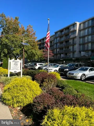 a view of swimming pool with a house in the background