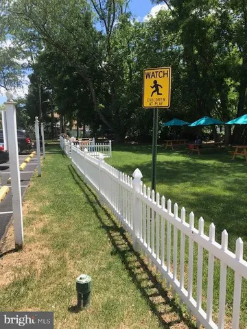a view of a golf course with a tree