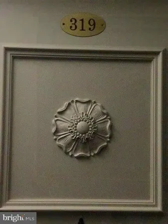 a view of a room with wooden floor and window