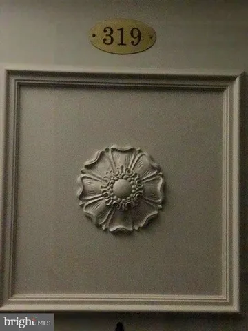 a view of a room with wooden floor and window