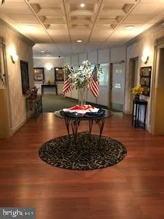 a living room with lots of furniture and a chandelier