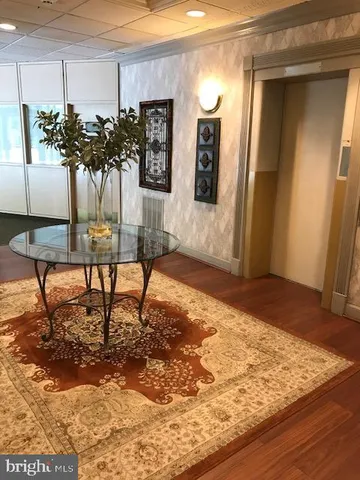 a view of a hardwood floor and staircase in a room