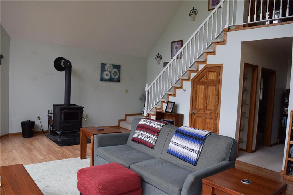 971 Haul Road Burgettstown, PA 15021 - Photo 5 of 25 Wood burning stove and stairs the lead to the master suite