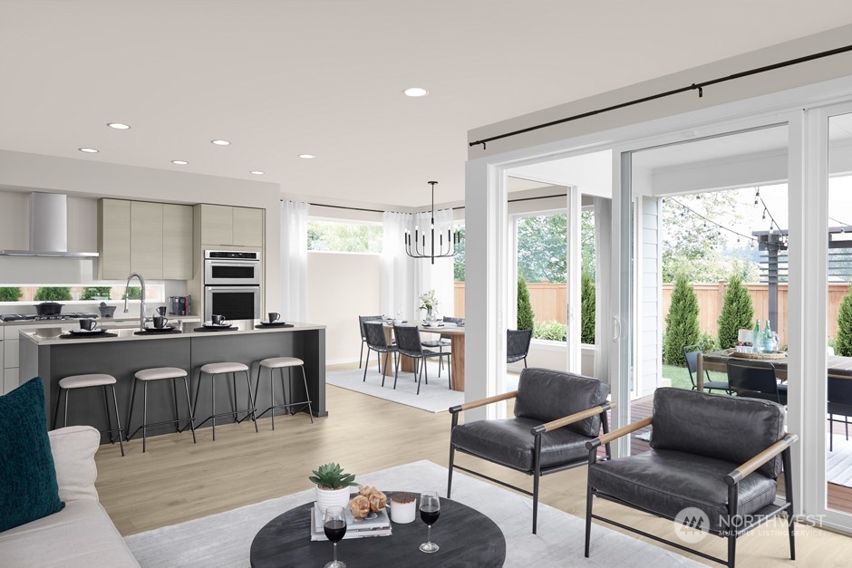 16040 Southeast 252 Place Covington, WA 98042 - Photo 4 of 11 a living room with furniture wooden floor and a large window