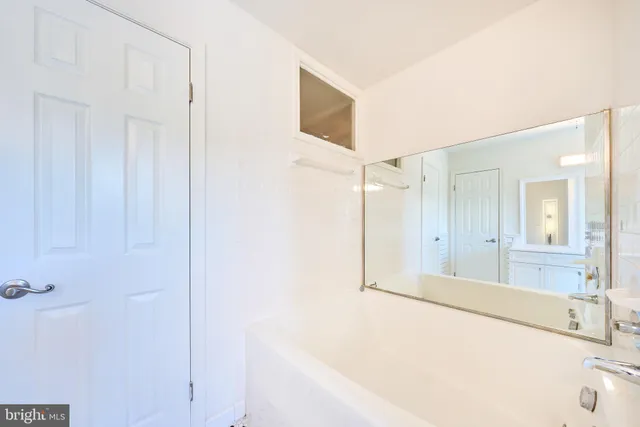 an empty room with wooden floor