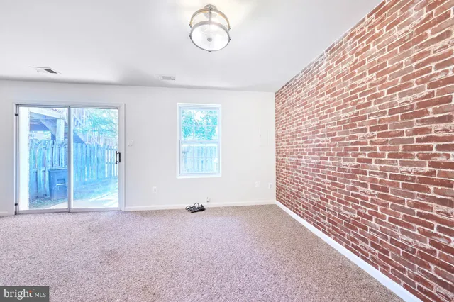 a bathroom with a toilet a sink a mirror a bathtub and vanity