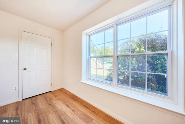 a view of a house with a small yard and plants