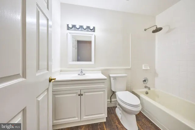 a view of backyard with wooden fence and trees