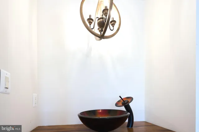 a view of a house with a large tree and a yard