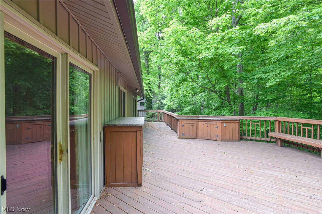 17612 Ridge Creek Road Strongsville, OH 44136 - Photo 14 of 31 The deck extends across the back of the house and overlooks a wooded ravine. Built-in units offer convenient storage.