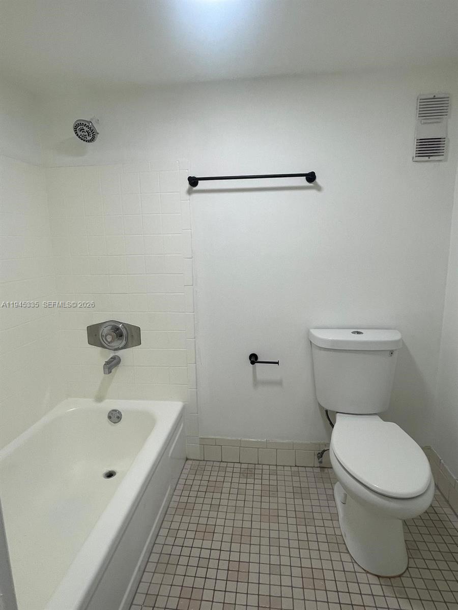 14830 Naranja Lakes Boulevard, Unit A2Q Homestead, FL 33032 - Photo 8 of 8 a bathroom with a bathtub and a toilet