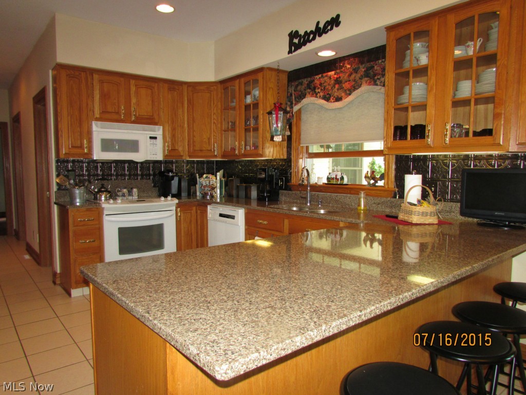 4645 Rock Spring Road Ravenna, OH 44266 - Photo 15 of 25 The appliances stay. Large kitchen with breakfast bar. Simply beautiful!
