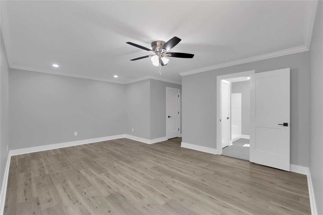 1747 A State Rd S-4-97 Anderson, SC 29621 - Photo 24 of 47 A spacious bedroom provides a blank canvas for personalization with durable flooring and overhead lighting.