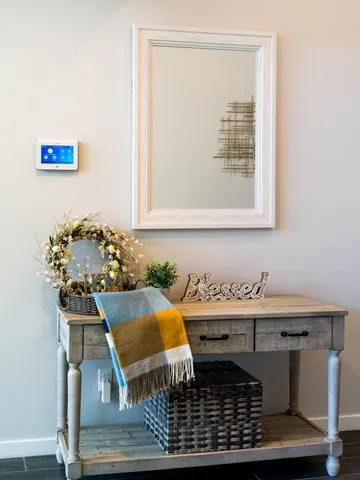 a bedroom with a bed dresser and a window