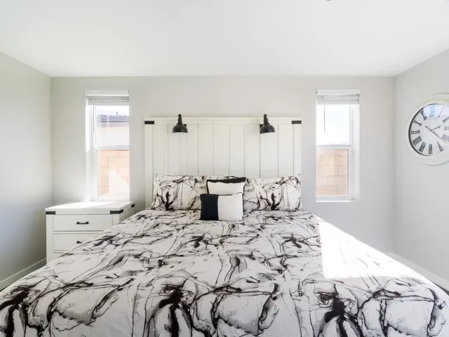 a bathroom with a sink double vanity and a mirror