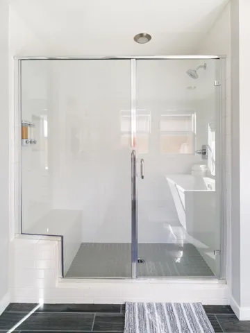 a room with a bed and a flat screen tv