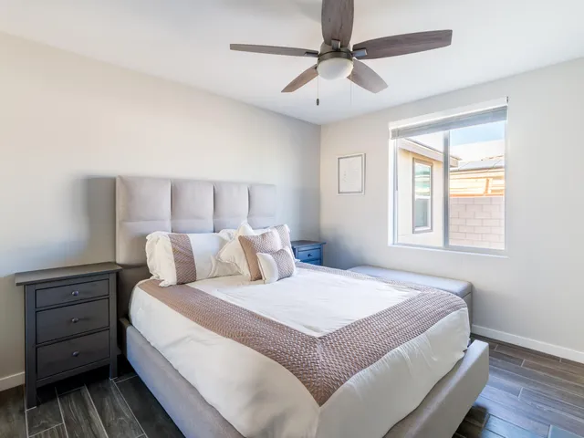 a bathroom with a granite countertop sink a toilet and shower