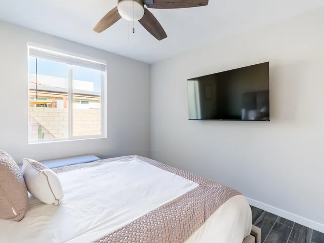 a bathroom with double vanity sinks and a mirror