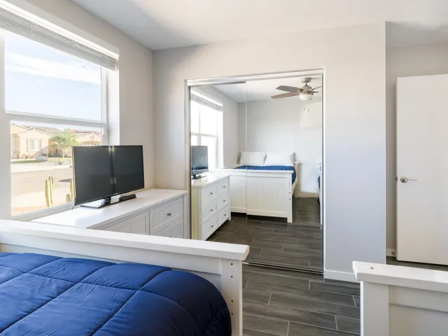 a bedroom with a bed and window