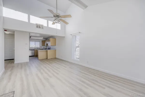 a view of a kitchen with a sink and cabinet area