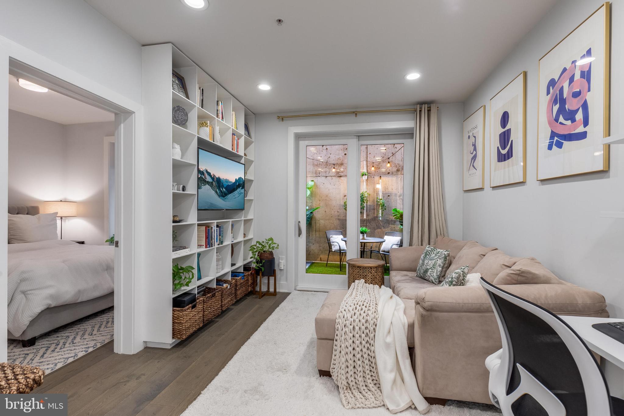 1412 Chapin Street Northwest, Unit 5 Washington, DC 20009 - Photo 12 of 23 a living room with furniture and a lamp