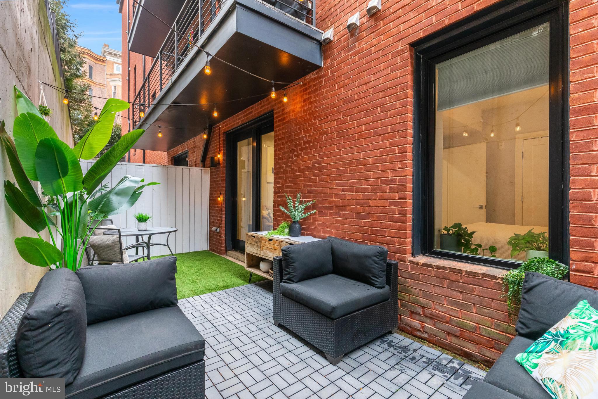 1412 Chapin Street Northwest, Unit 5 Washington, DC 20009 - Photo 19 of 23 a view of a patio with couches and potted plants