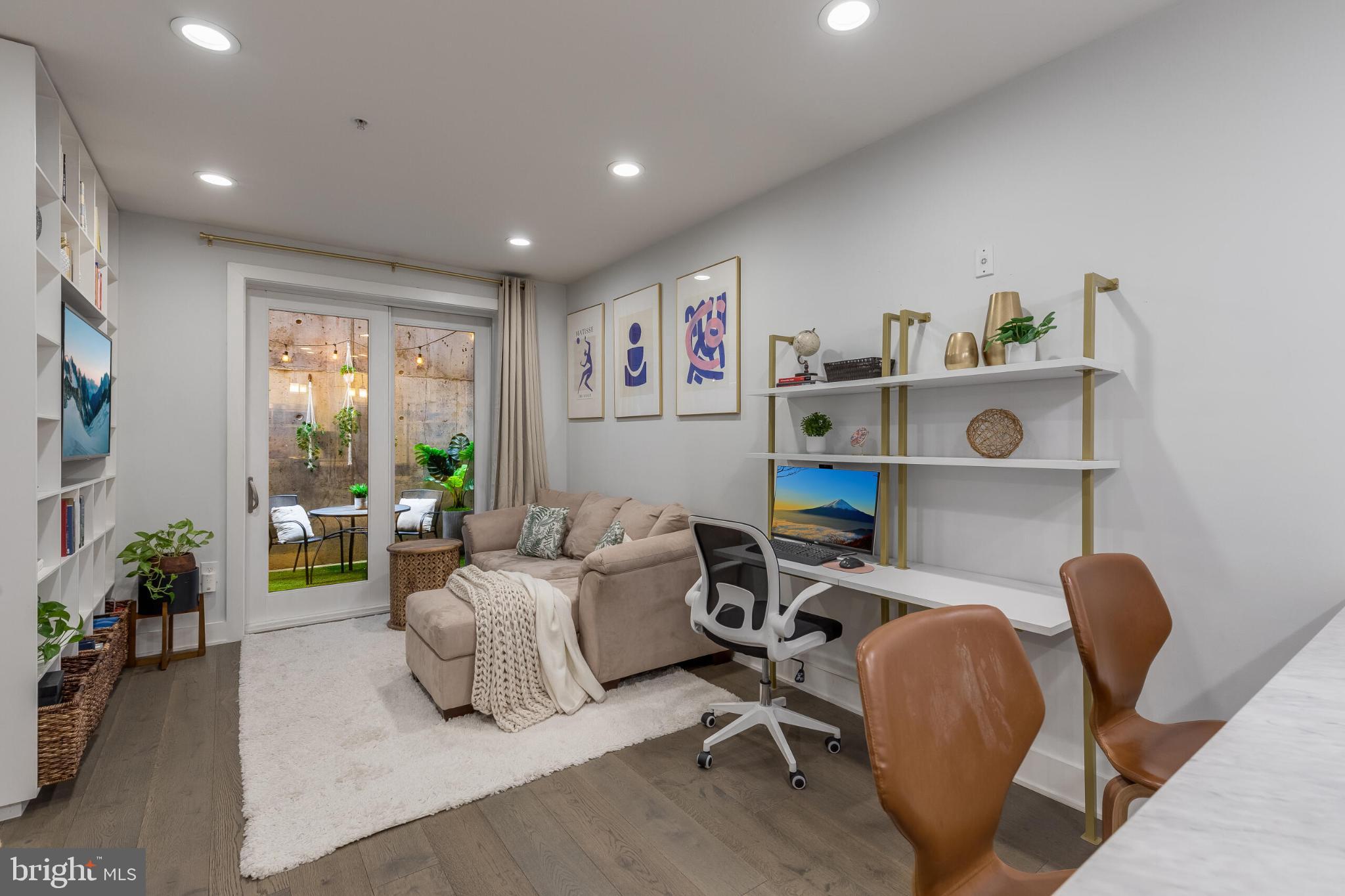 1412 Chapin Street Northwest, Unit 5 Washington, DC 20009 - Photo 8 of 23 a living room with furniture and a large window