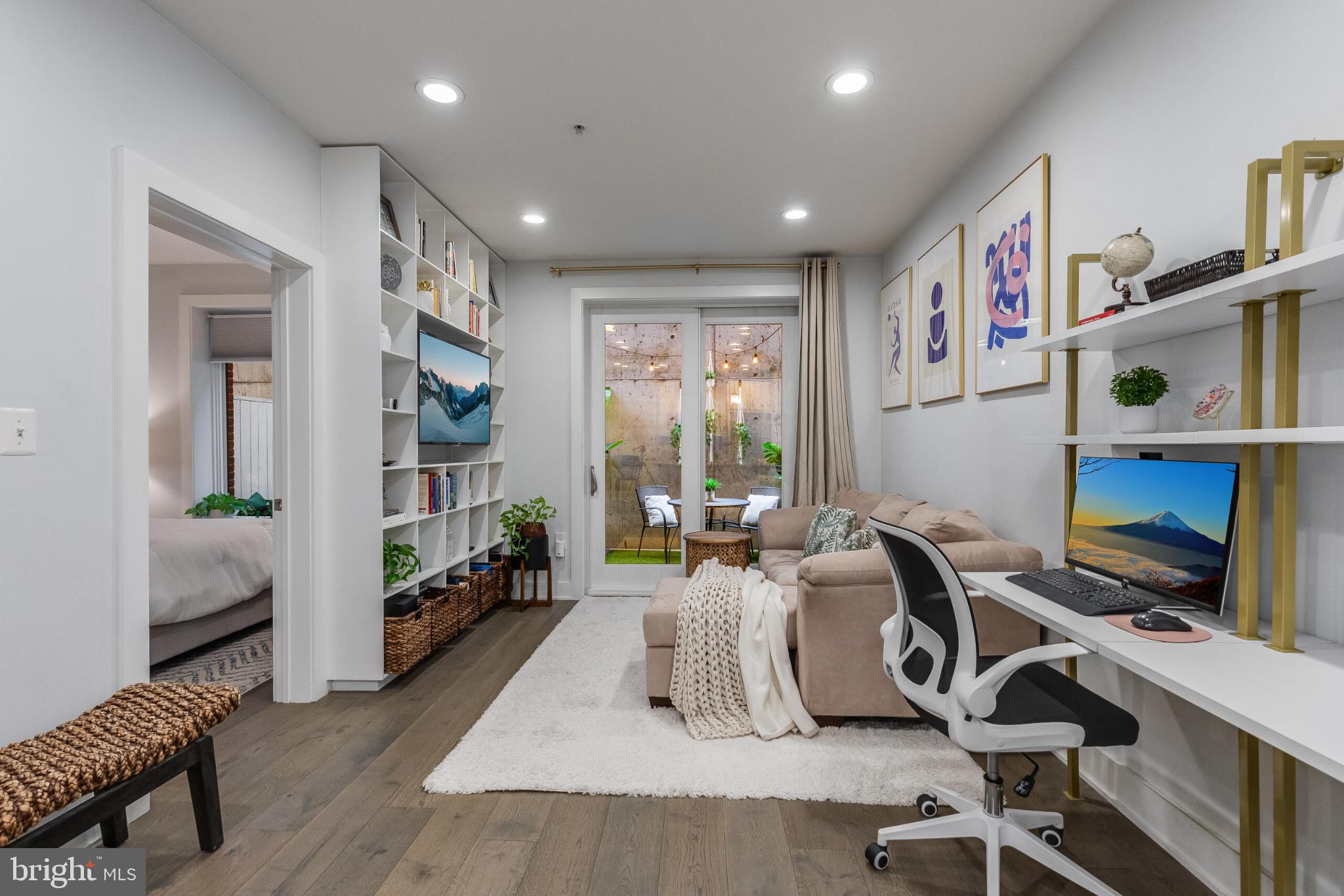 1412 Chapin Street Northwest, Unit 5 Washington, DC 20009 - Photo 9 of 23 a work room with furniture and a wooden floor