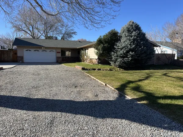 a view of a backyard of the house