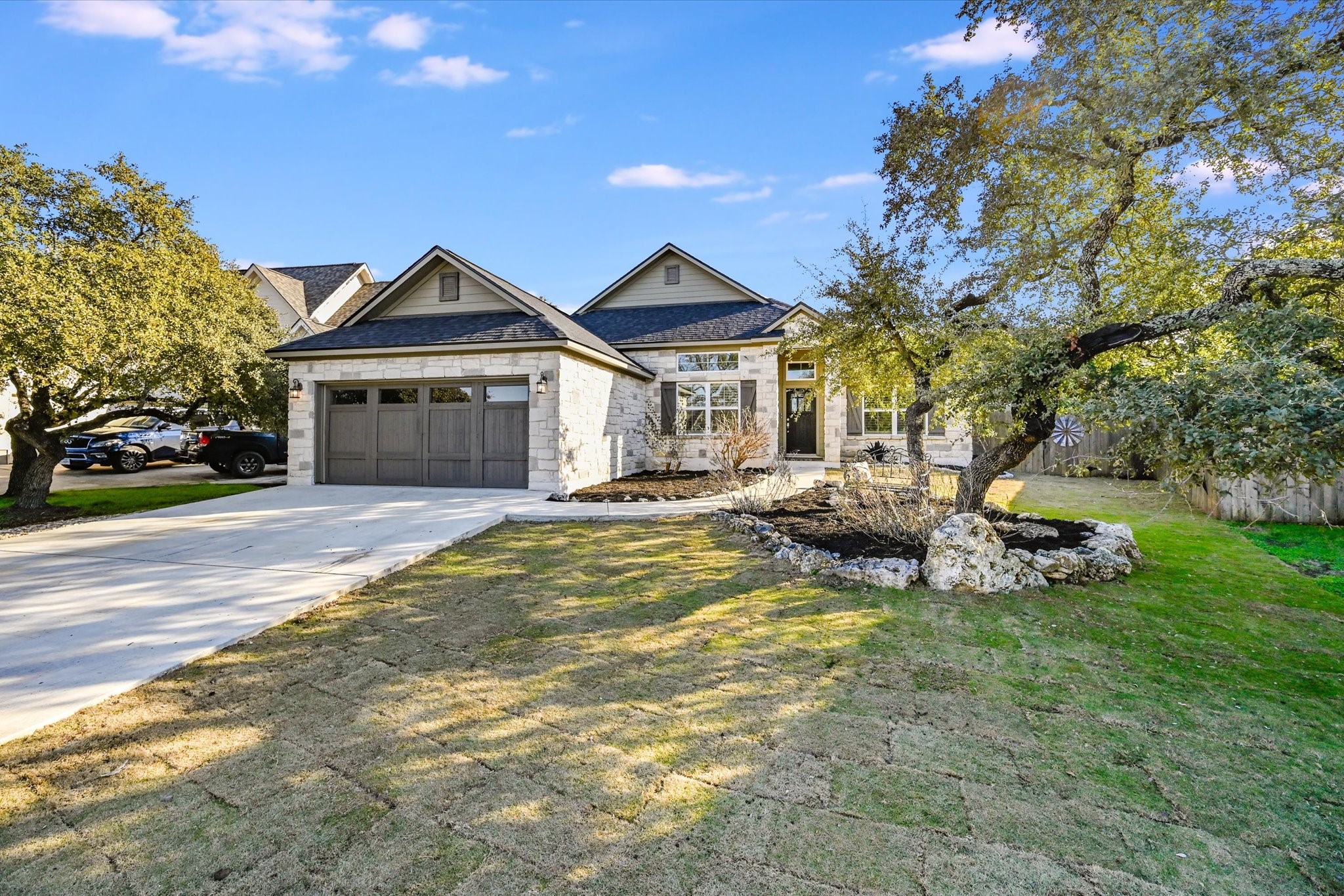 90 Ridgewood Circle Wimberley, TX 78676 - Photo 1 of 1 Street view of house: Rock front, custom garage door, fresh sod & mulch, rock beds & more.