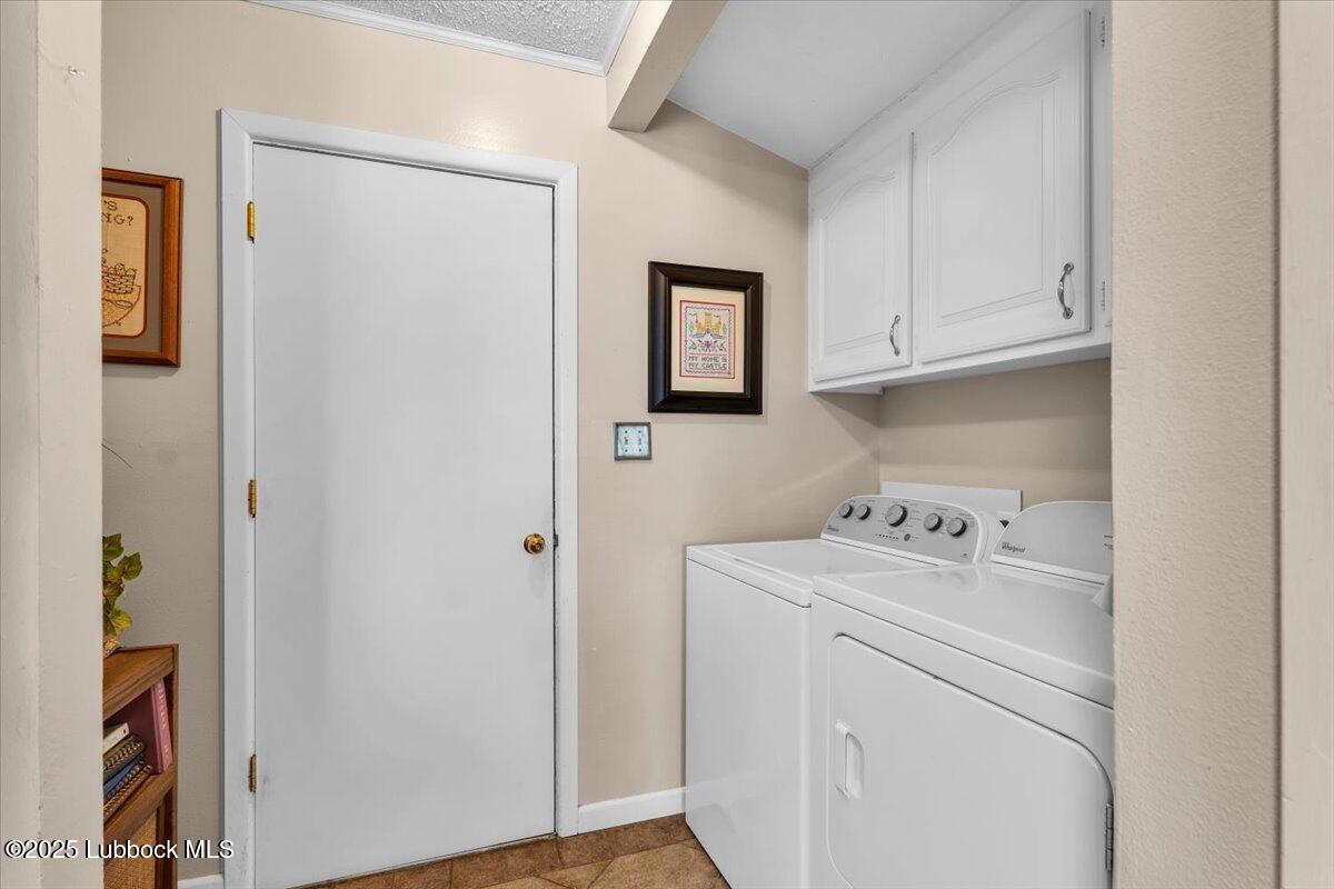 1405 3rd Street Plains, TX 79355 - Photo 3 of 19 a utility room with dryer and washer