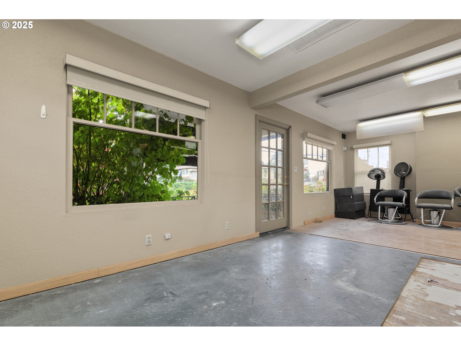 6055 East Burnside Street Portland, OR 97213 - Photo 13 of 32 a living room with furniture and a large window