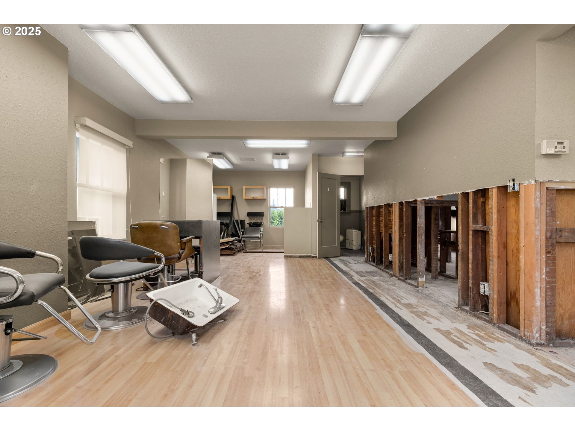 6055 East Burnside Street Portland, OR 97213 - Photo 15 of 32 a living room with lots of furniture and a wooden floor