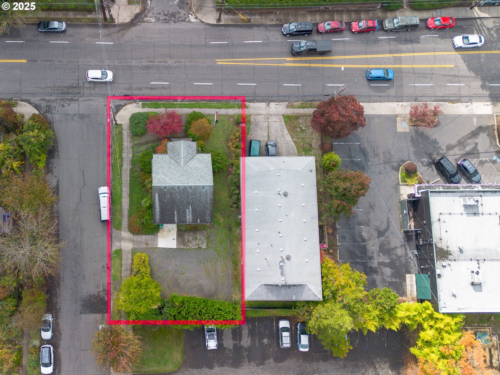 6055 East Burnside Street Portland, OR 97213 - Photo 3 of 32 a front view of a house with a yard