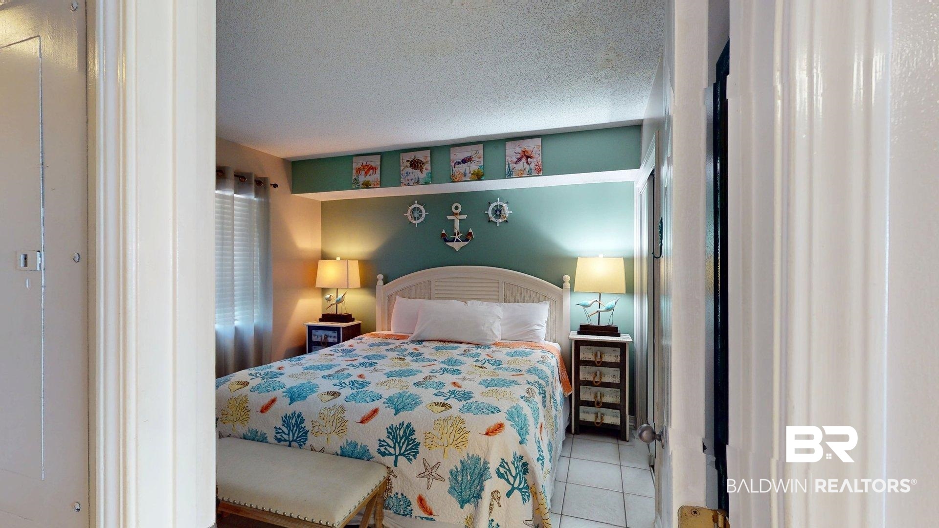 645 Plantation Road, Unit 6503 Gulf Shores, AL 36542 - Photo 44 of 53 Bedroom featuring tile patterned floors and a textured ceiling