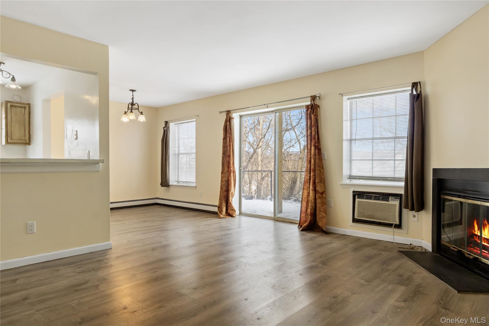 7 Lexington Hills Road, Unit 8 Harriman, NY 10926 - Photo 12 of 17 a view of an empty room with a fireplace and a window